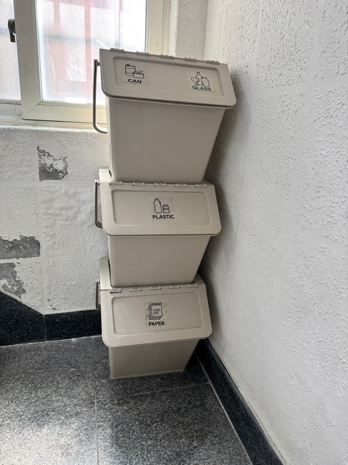 Recycling bins between the 3rd and 4th floors